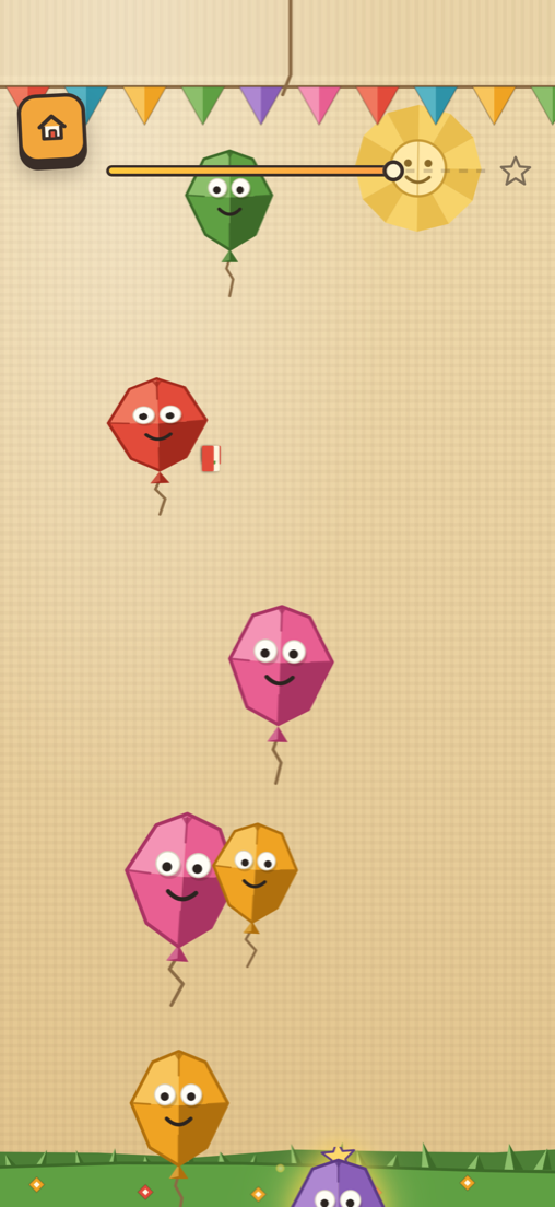Poplings Paper Party world: cut-paper balloons on a kraft paper scrapbook page